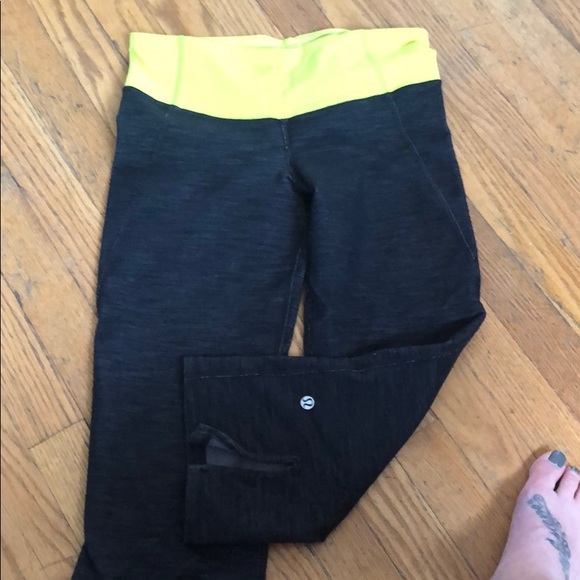 Black Heathered lululemon capris with yellow band - Picture 2 of 3